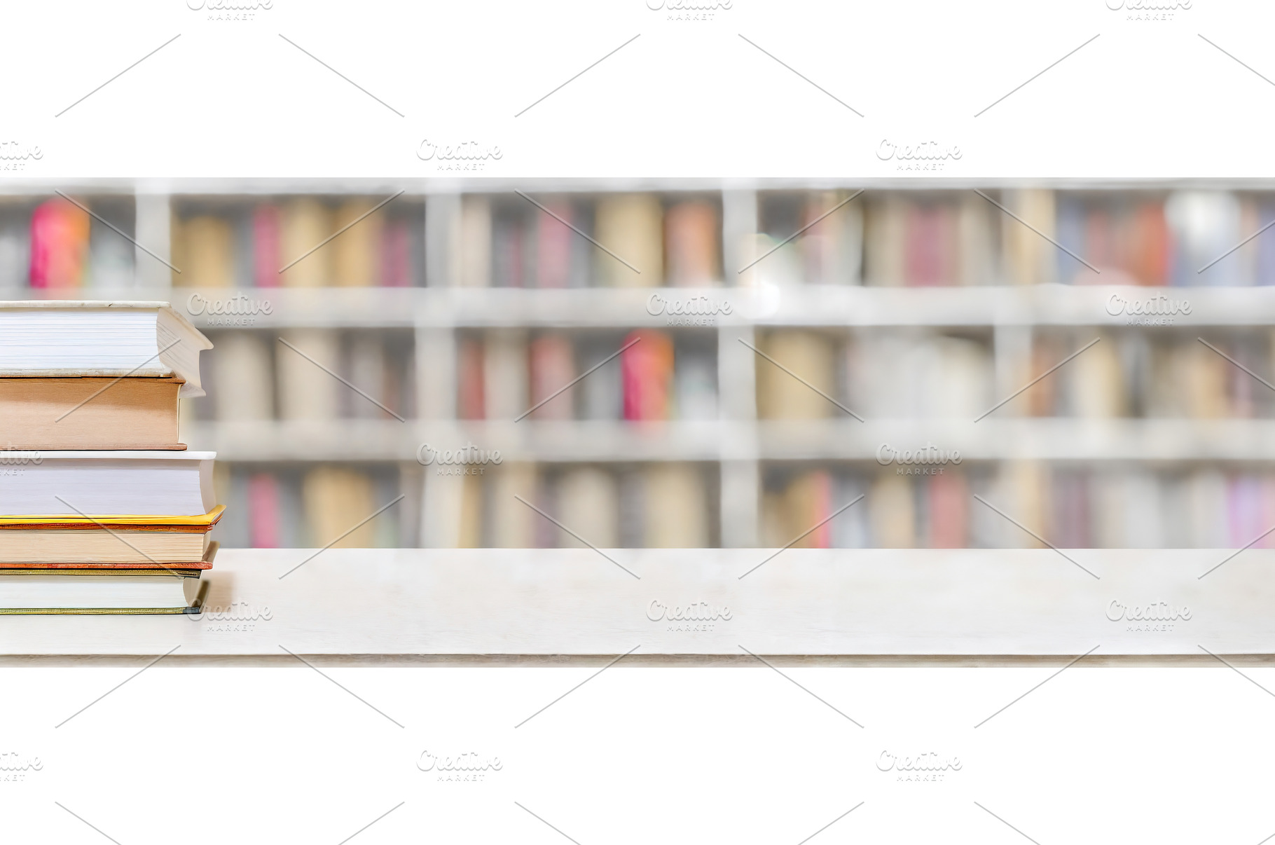 A stack of books on a white table, a School & Education Photo by Igor Tichonow