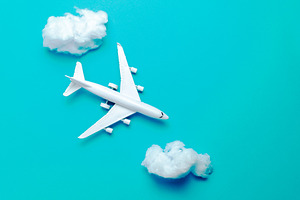 Jet airplane flying between the clou featuring plane, travel, and idea