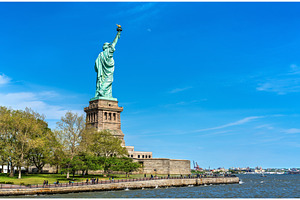 The statue of liberty on liberty island in new york city stock photo, an Architecture Photo by Leonid Andronov
