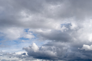 Dark stormy clouds moving across the dramatic sky, a Photo by GoodGoods