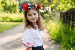 Young girl in folk costume, a Nature Photo by HalfPoint