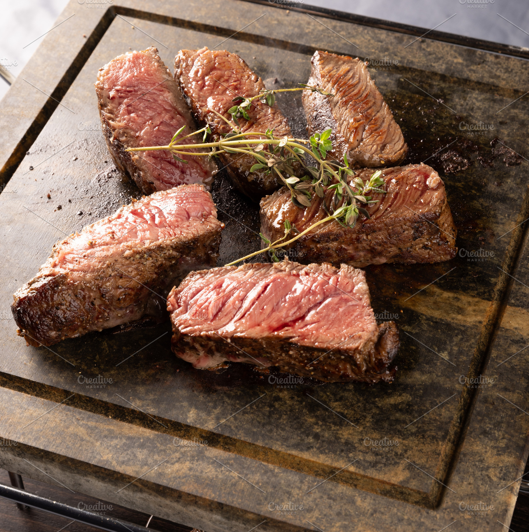 Close up of juicy grilled steaks, a Photo by Grafvision photography