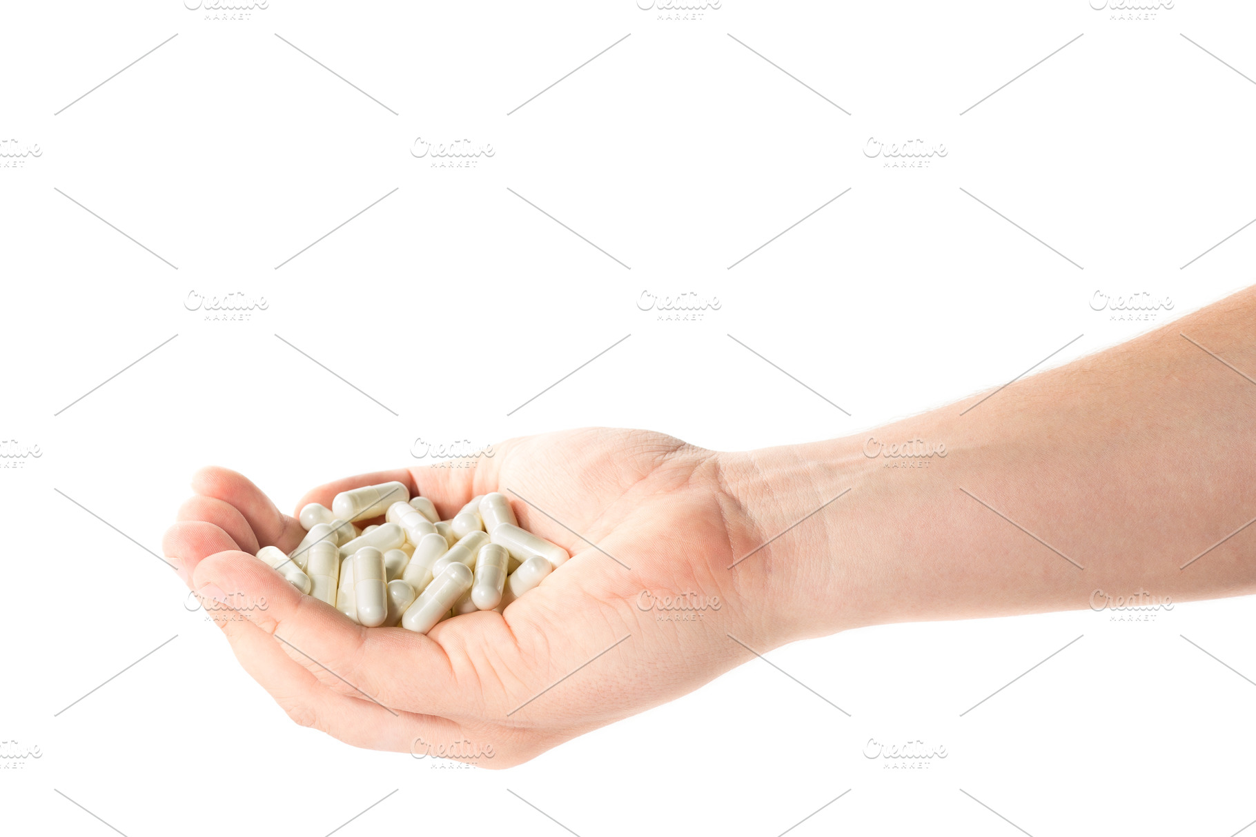 Image of a hand full of medical capsules on a white background, a Background Photo by Evgeniy Losev