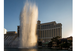 Sunset illuminates the fountains in, an Architecture Photo by Backyard Stock