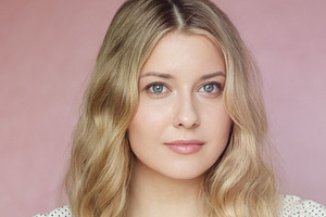 Portrait of a serene young woman with soft wavy blonde hair and, a Person Photo by Studio ANNA