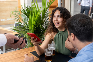 Woman Paying the Bill with Smartphone at a Restaurant, a Person Photo by etorres69