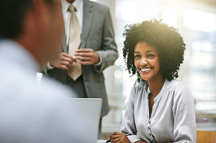 Working with a smile, a Photo by Peopleimages.com