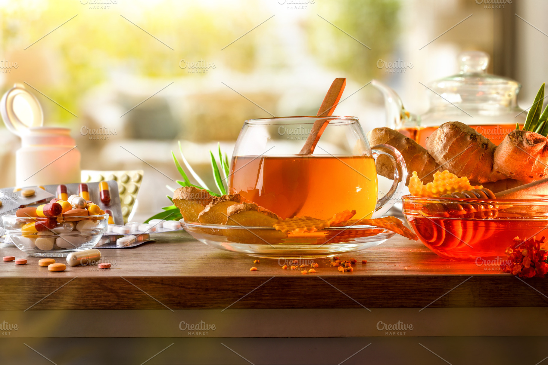 Natural medicine versus pharmaceuticals with infusion on wooden, a Food & Drink Photo by Davizro's Market