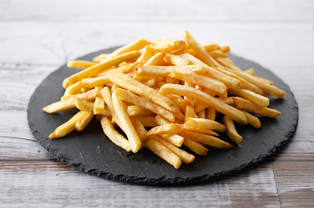 Fried potatoes, french fries on wooden table, a Food & Drink Photo by etorres69