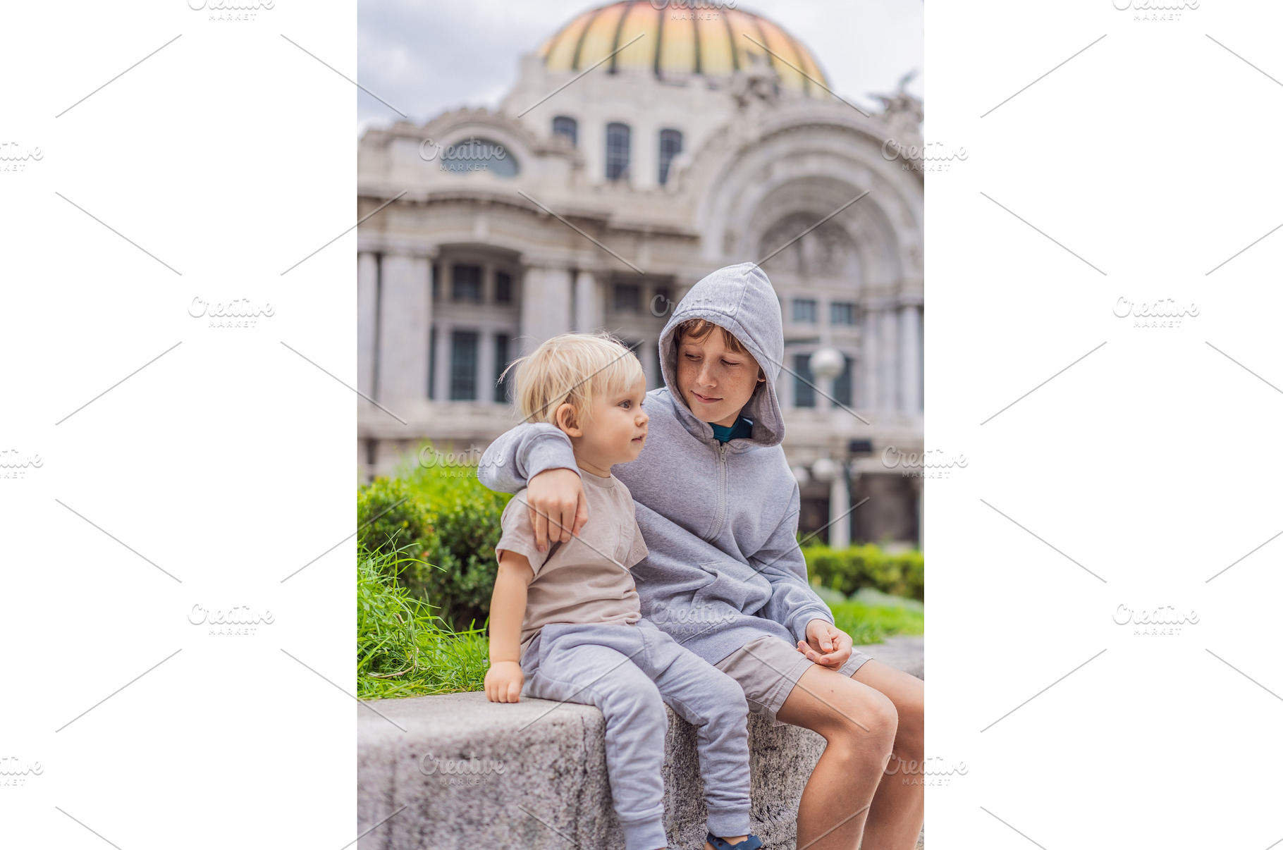 Two young boy tourists in front of, an Architecture Photo by Elizaveta Galitskaya