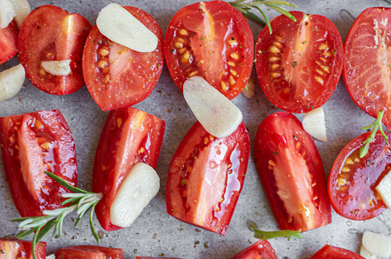 Fresh tomato slices with herbs, a Food & Drink Photo by Olena Rudo