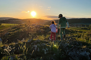 Children exploring nature during a beautiful sunset hike in the hills, a Photo by AS photostudio