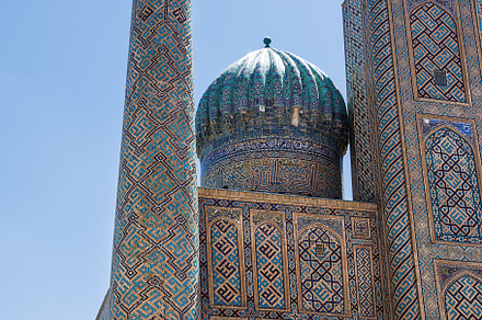 Tower decorated with mosaics in the Registan square in Samarkand, an Architecture Photo by Angelo D'Amico Photograph
