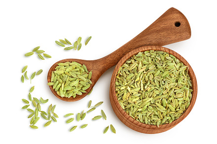 Dried fennel seeds in wooden bowl, a Food & Drink Photo by NataPhoto