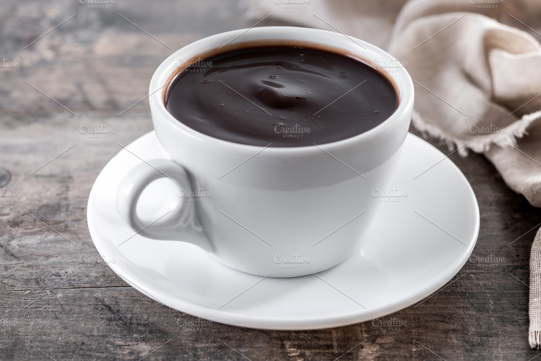Spanish churros with hot thick chocolate in a white cup, a Food & Drink Photo by etorres69