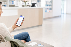 Woman checking flu season preparatio, a Photo by Dvoevnore photos