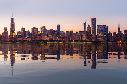 Sunset over city skyline Chicago, an Architecture Photo by Backyard Stock