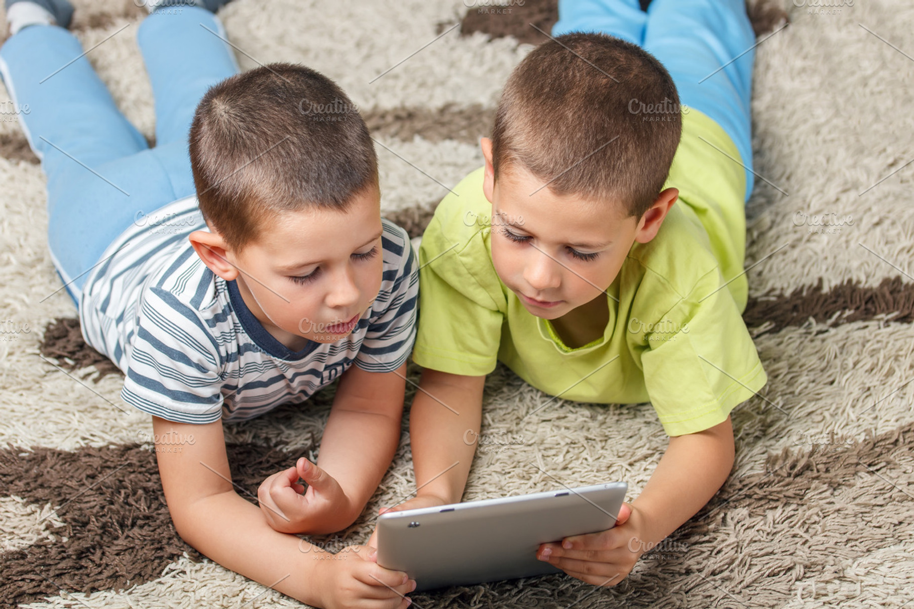 Children containing tablet, child, and game