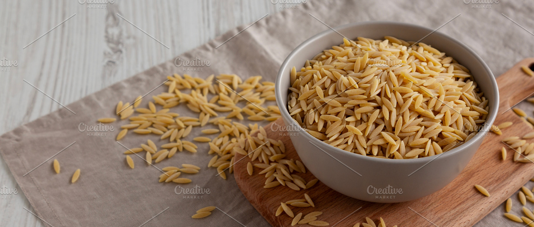 Organic Dried Orzo Pasta in a Bowl, side view., a Food & Drink Photo by LiudmylaChuhunova