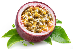 Dark purple passion fruit half with seedy interior laying on gre, a Food & Drink Photo by Volff