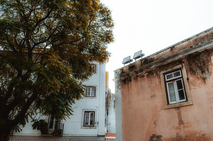 Two halogen lamps on an old roof, an Architecture Photo by SkyNext