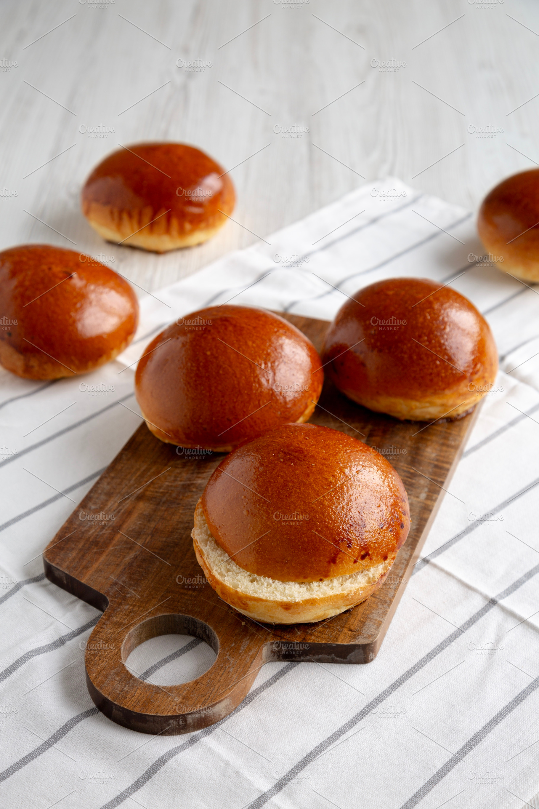 Homemade Brioche Buns Ready to Eat, side view. Copy space., a Food & Drink Photo by LiudmylaChuhunova
