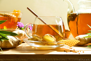 Ginger and honey drink in a glass cup front view, a Food & Drink Photo by Davizro's Market