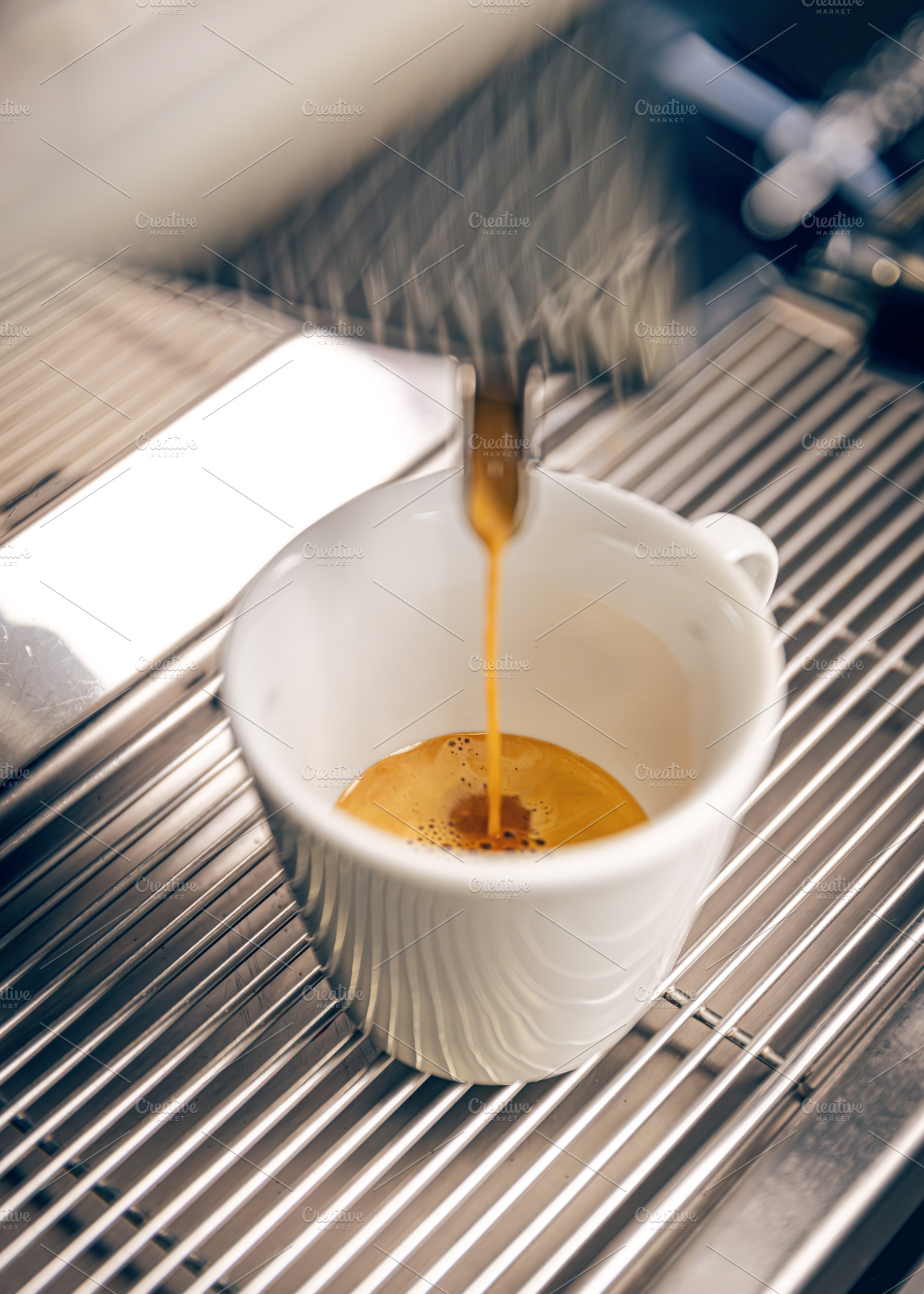 Professional coffee machine pouring espresso coffee, a Photo by Grafvision photography