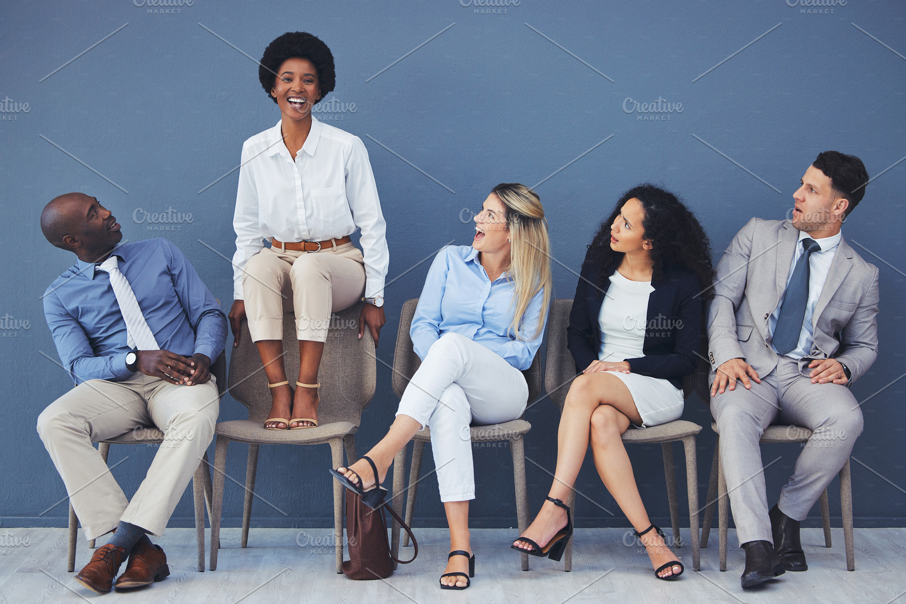 Business people, hiring and waiting room of woman standing out against wall for interview, meeting or opportunity. Group of diverse interns looking at African American female candidate in recruitment, a Photo by Peopleimages.com