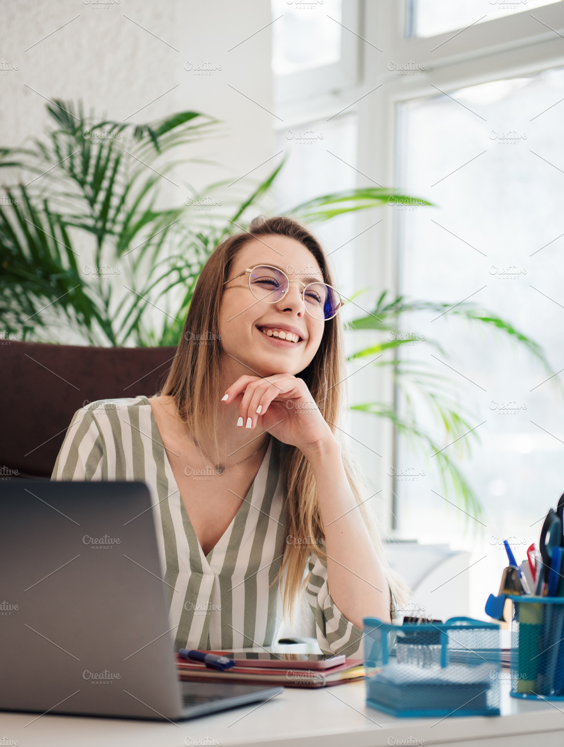 Young woman working on a computer, a Business Photo by Olena Rudo