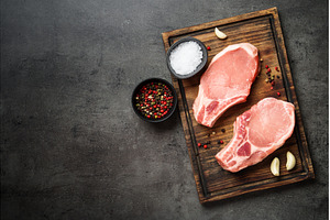 Raw pork meat steaks on cutting, a Food & Drink Photo by Nadia-nb