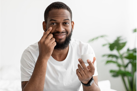 Happy young black bearded man hold, a Person Photo by Prostock-Studio