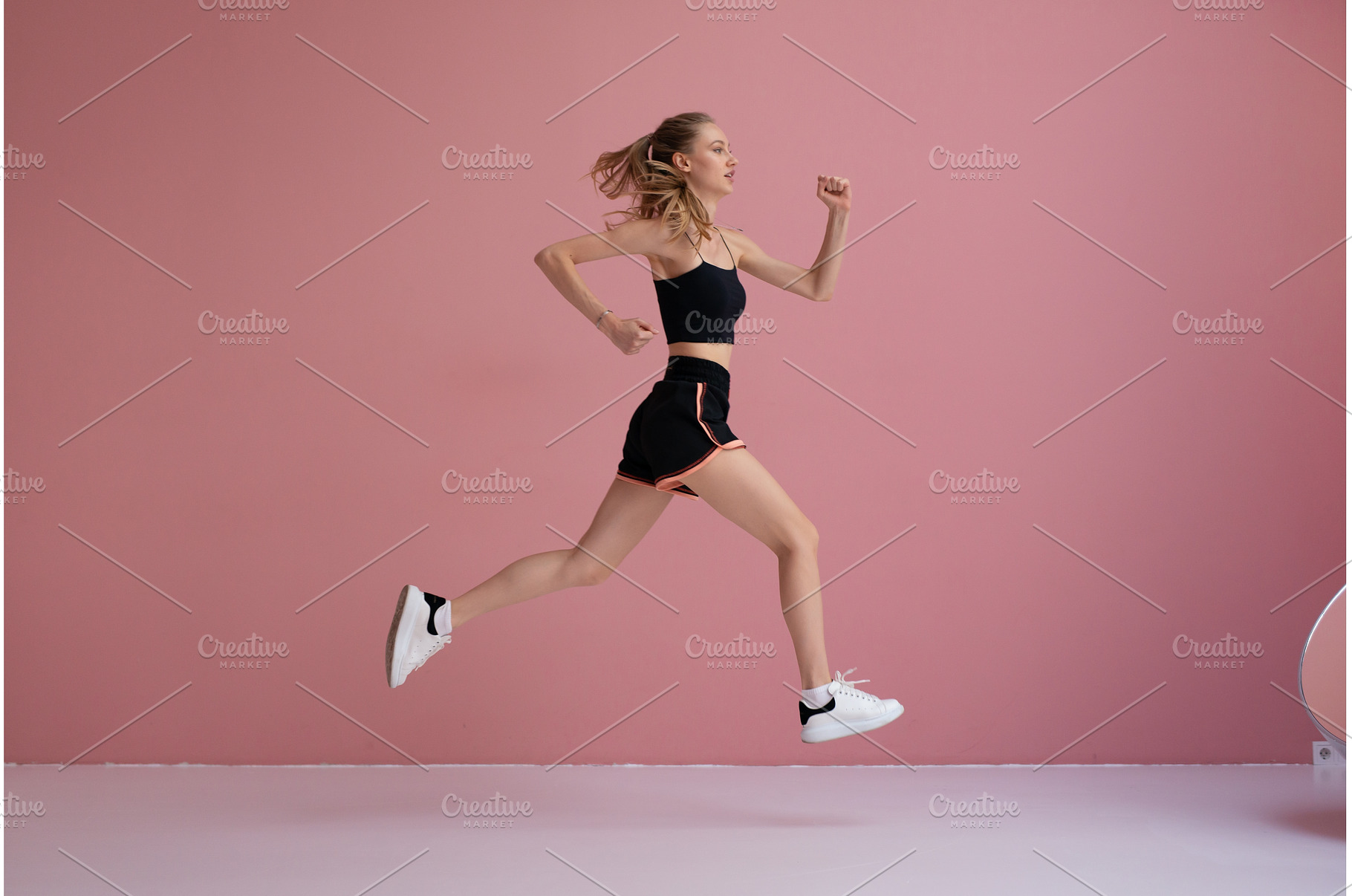 Young athletic woman mid air, full, a Sports & Recreation Photo by undrey
