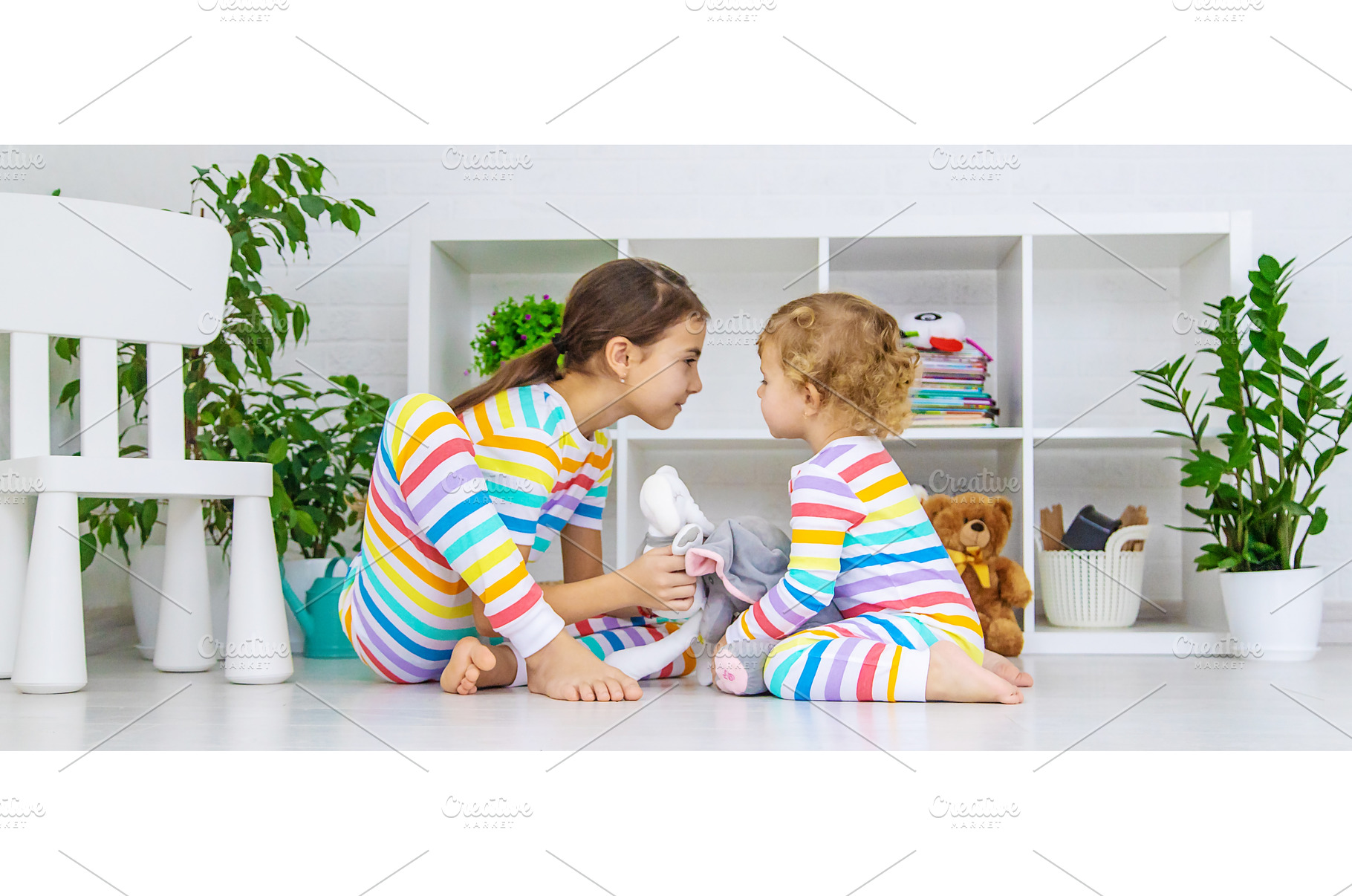 The sister child is playing in the, a Person Photo by yanadjana