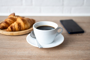 Buttered whole wheat toast with black coffee and smartphone, a Food & Drink Photo by etorres69