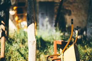 Rustic yard with old wheelbarrow, an Industrial Photo by SkyNext