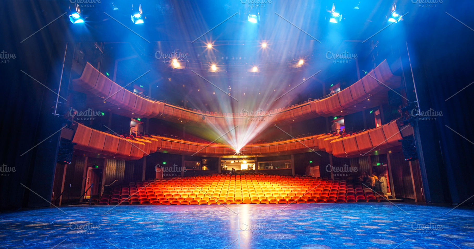 Theater Stage with light beams, an Arts & Entertainment Photo by HBStocks