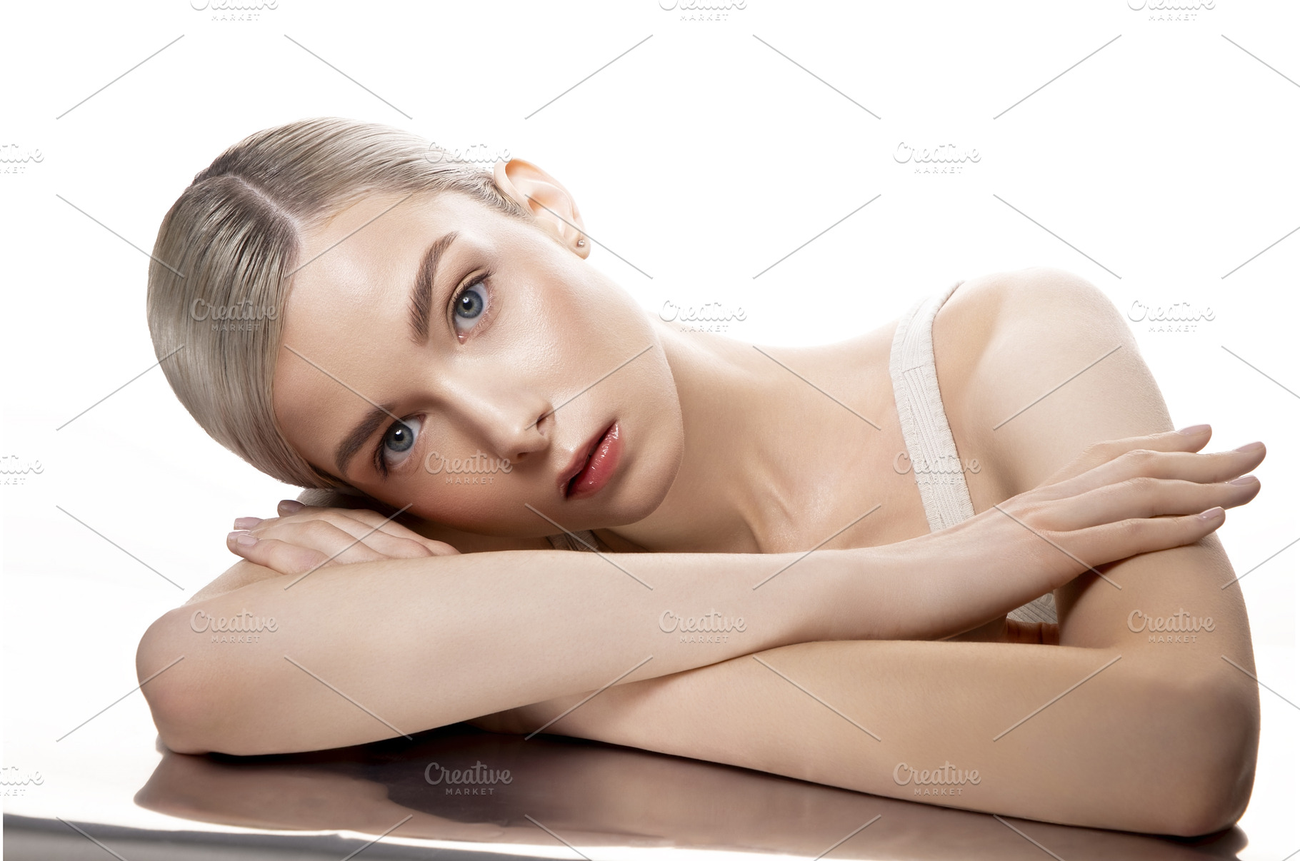 A woman is lying on a table with her, a Beauty & Fashion Photo by korabkova