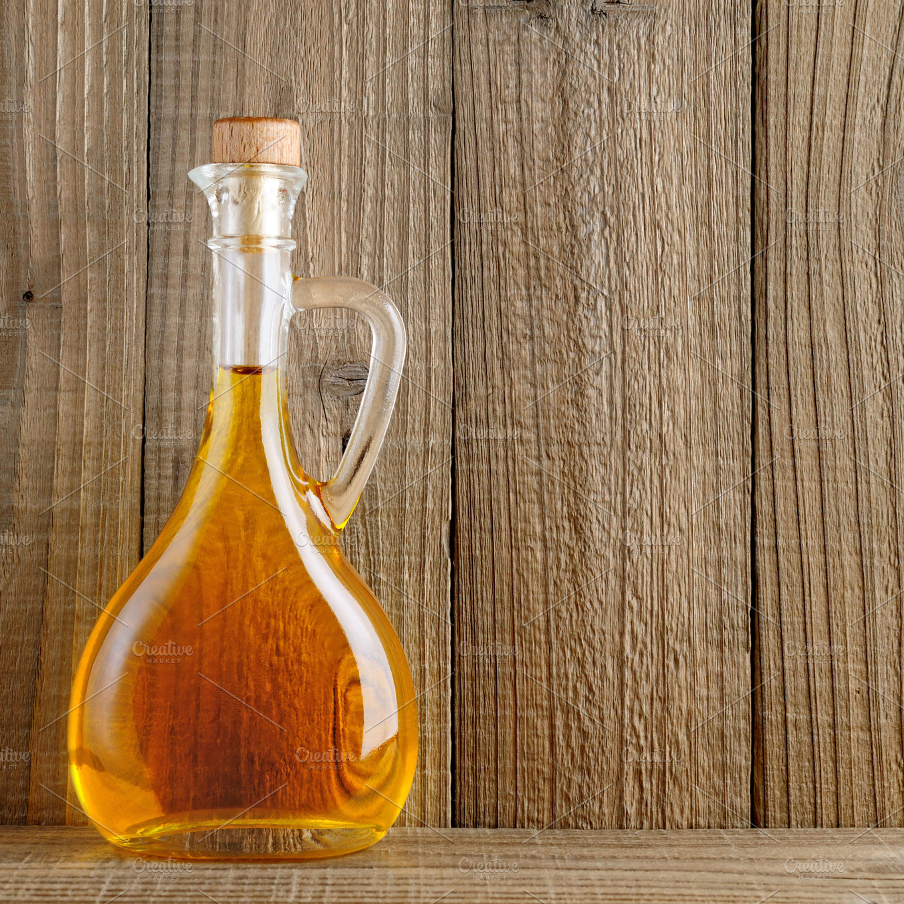 Bottle of olive oil containing oil, olive, and yellow
