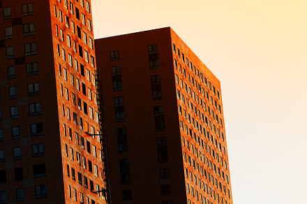 Dramatically illuminated front of highrise house background, an Architecture Photo by RETROWAVE '88