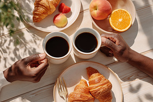 Enjoying a cozy breakfast with coffee and pastries in a sunny outdoor setting, a Photo by AlyaAnd
