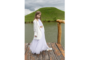 Little girl in a white festive dress, a Person Photo by Nenahliadava Design