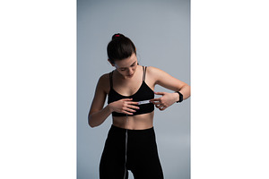 Woman measuring body, checking, a Sports & Recreation Photo by volodymyrshtun13795