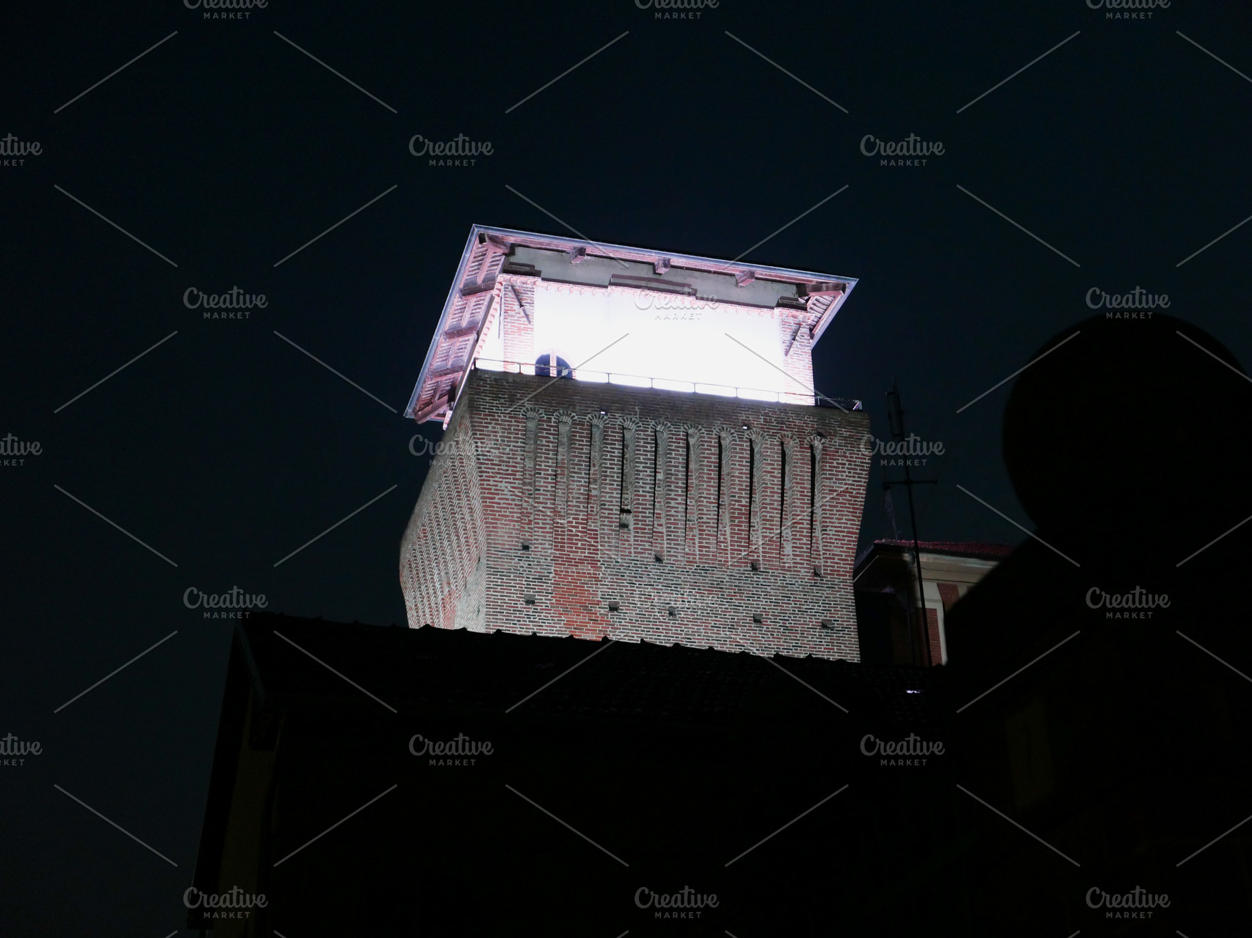 Medieval Tower at night in Settimo Torinese, a Photo by WorldOfPhotos
