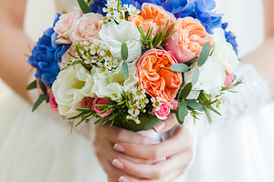 Wedding bouquet in hands bride