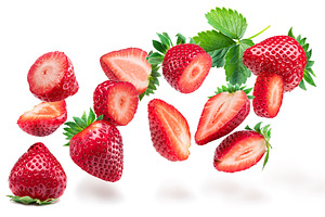 Sliced strawberry flying in the air isolated on white background, a Food & Drink Photo by Volff