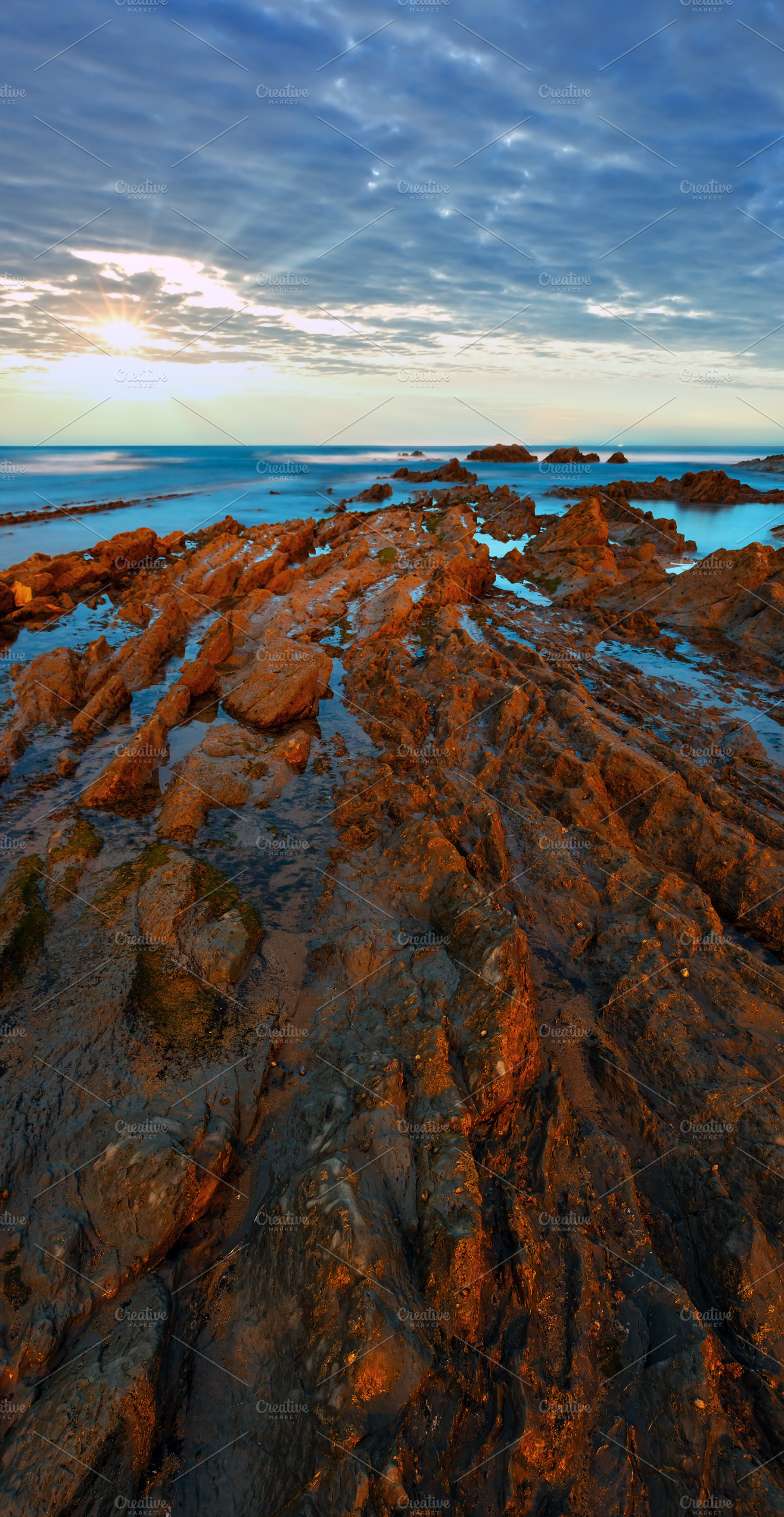 Twilight ocean coast with ribbed stratiform rock., a Nature Photo by YuriyB