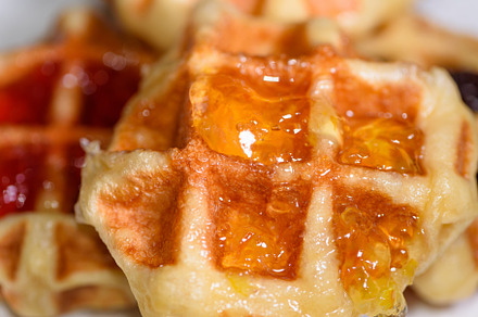 Close up fresh waffles topped with above pineapple jam