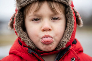 Close up portrait of playful toddler, a Person Photo by Virgo Studio