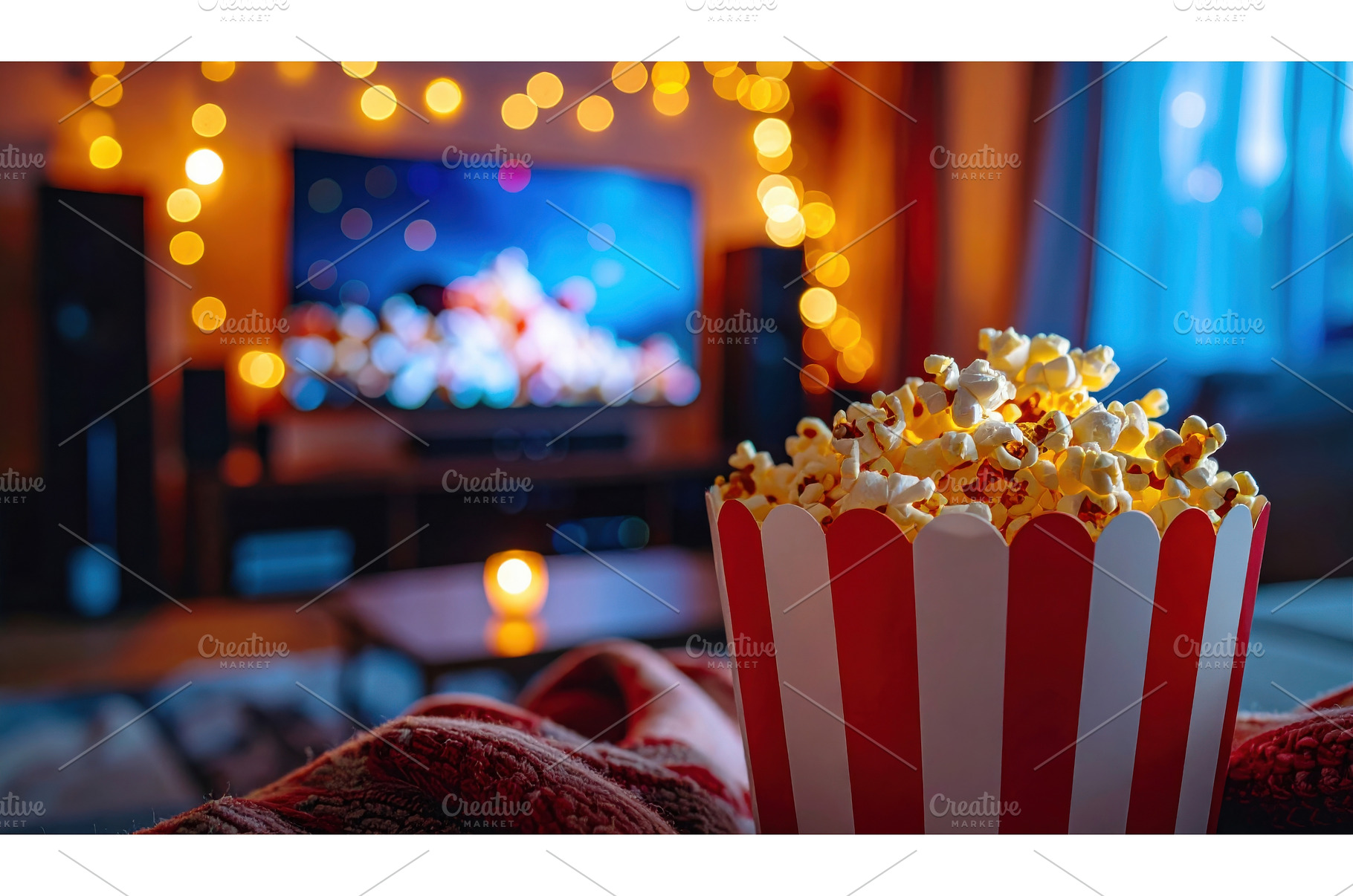 Popcorn in a red-striped bucket with, a Holiday Photo by Igor Tichonow